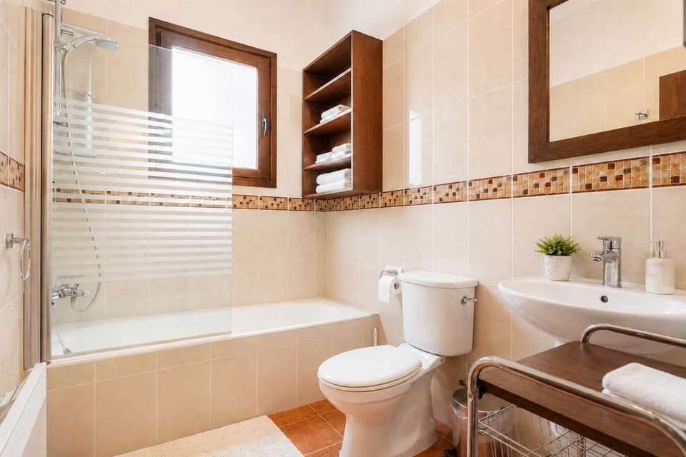 Family bathroom with bath and shower