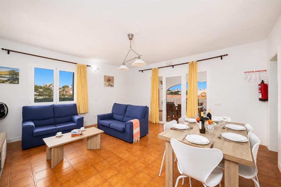 Living room with sofas, dining area, WiFi internet, and satellite TV