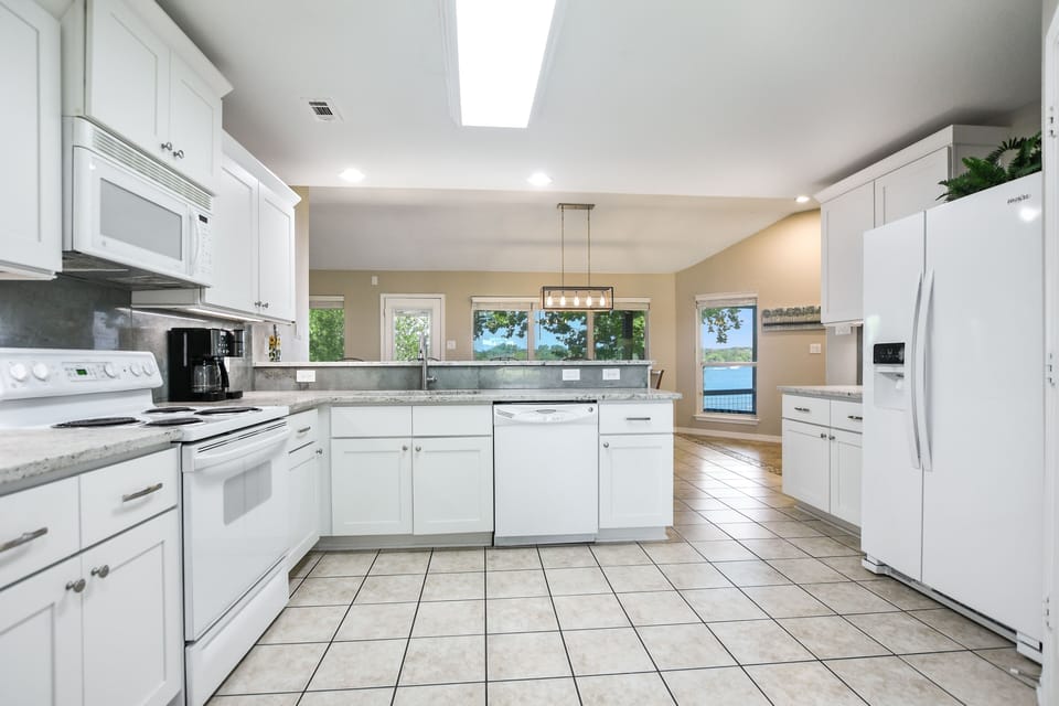 Fully stocked kitchen, granite countertops. Full size washer/dryer