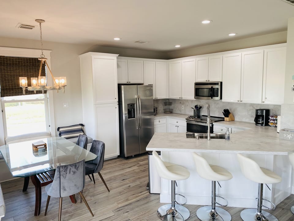 Prep food in the spacious kitchen while still feeling part of the group!