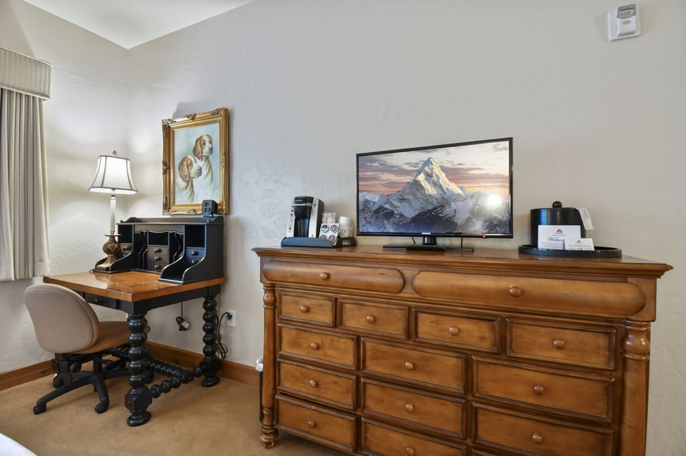 Guest bedroom offers flat screen tv and Keurig with 4 complimentary pods