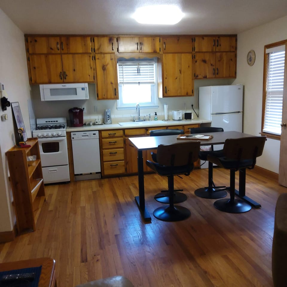 In kitchen seating for 4 with adjustable height table and chairs.