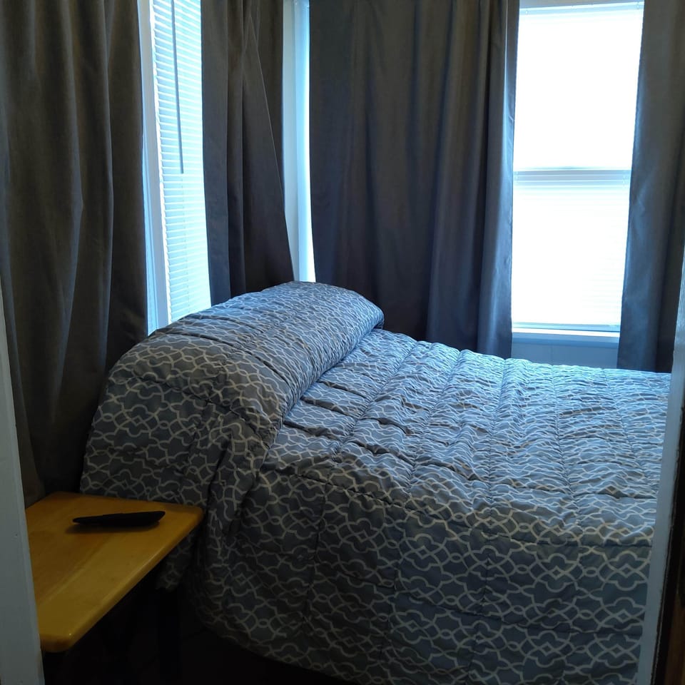 Second bedroom with electric adjustable bed.