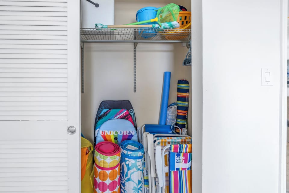 closet with various complimentary beach supplies