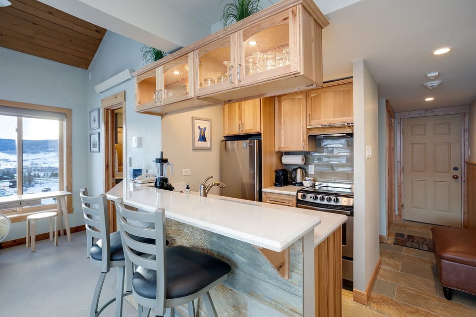 Your modern kitchen features warm wood cabinets, granite countertops, and stainless steel appliances, creating the perfect space for preparing meals together.