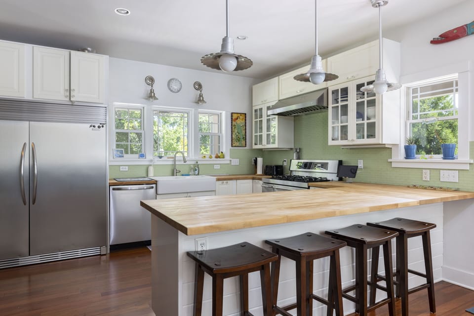 Kitchen with full size refrigerator and freezer