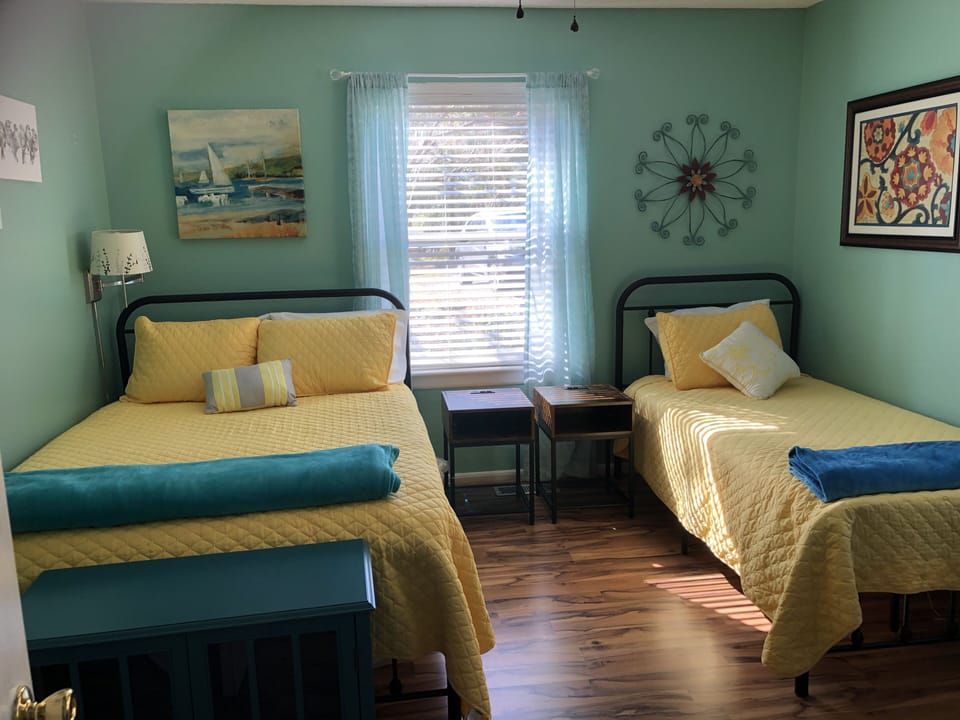 This bedroom has twin and full size beds.  It is on the main level.