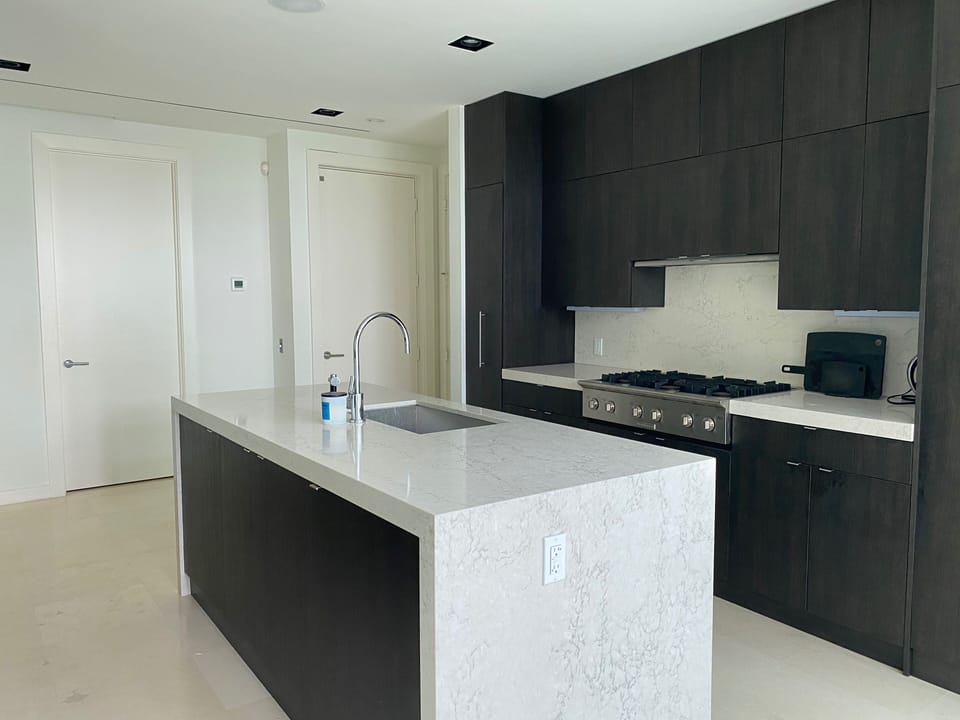 Kitchen - the left door is the half bath and the right door is the elevator 