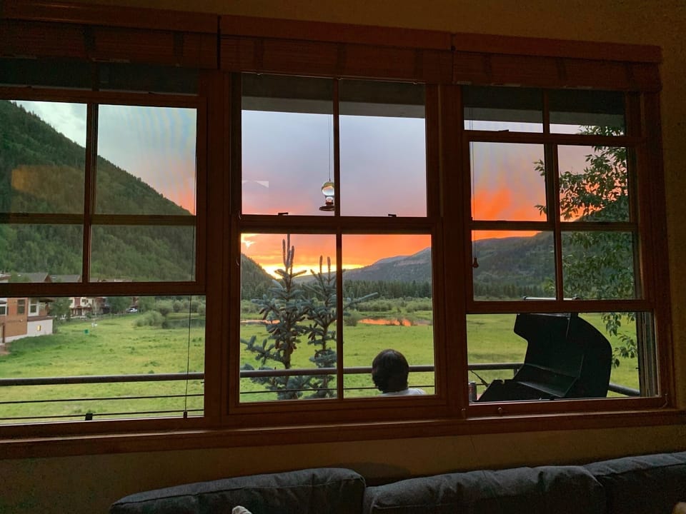 sunset view of the valley floor from the windows and deck on the top floor