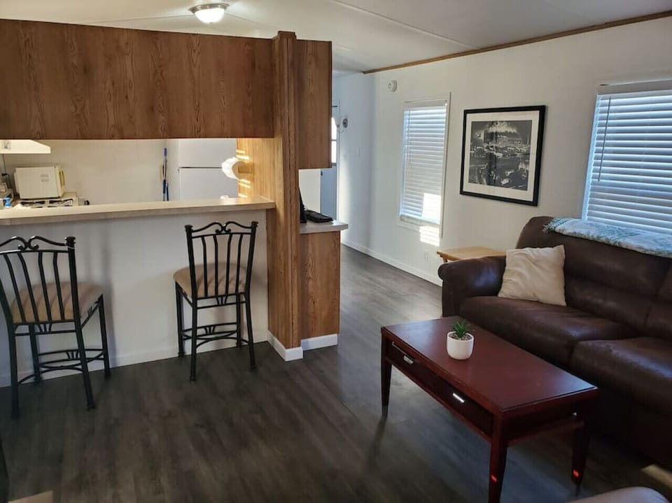 Kitchen includes refrigerator, sink and Microwave (No oven)