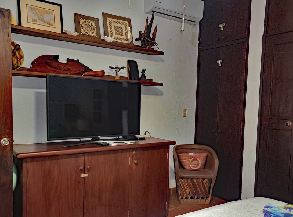 The Master Bedroom Also Has a A Large Dresser and TV!