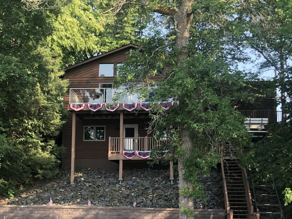 Lake side of property, tons of windows for amazing lake views