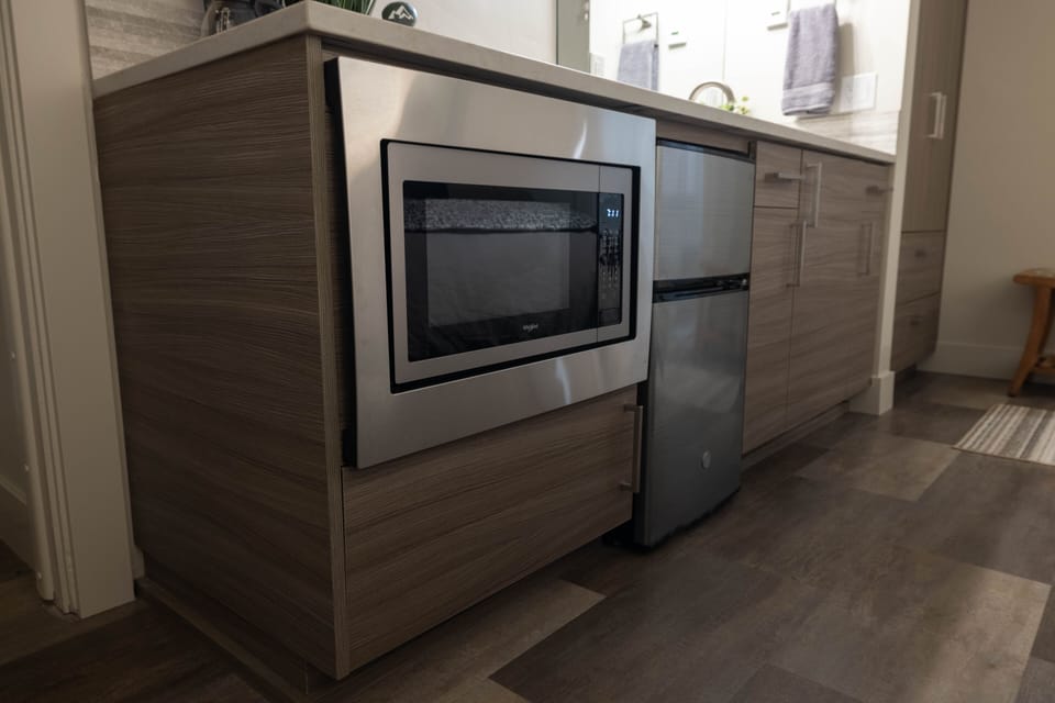 Bedroom has microwave and mini fridge