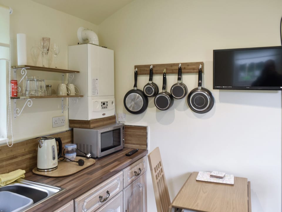 Kitchen and dining area | Shepherds Hut 1 in Kent - The Shepherds Huts at Laddingford, Laddingford, near Maidstone