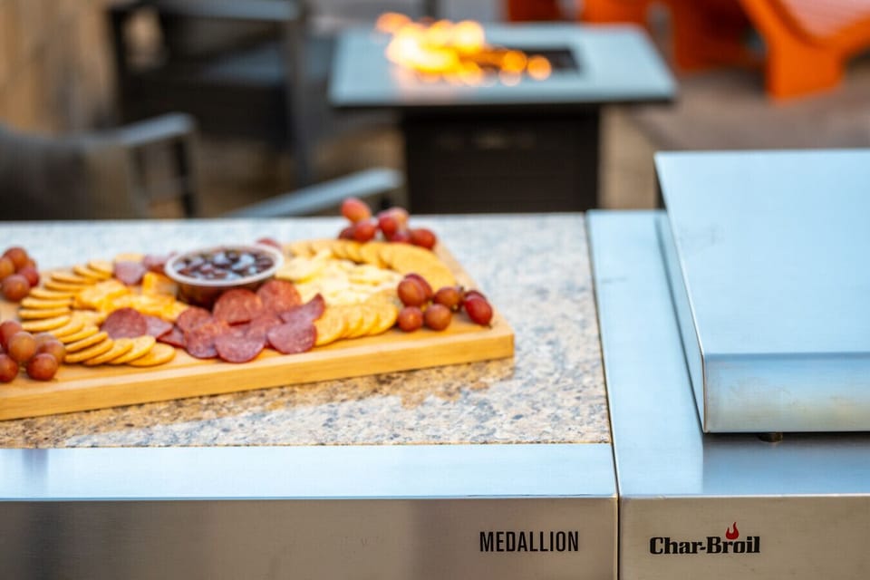 BBQ side: brand new stainless steel kitchen island with grill, sink, stove top