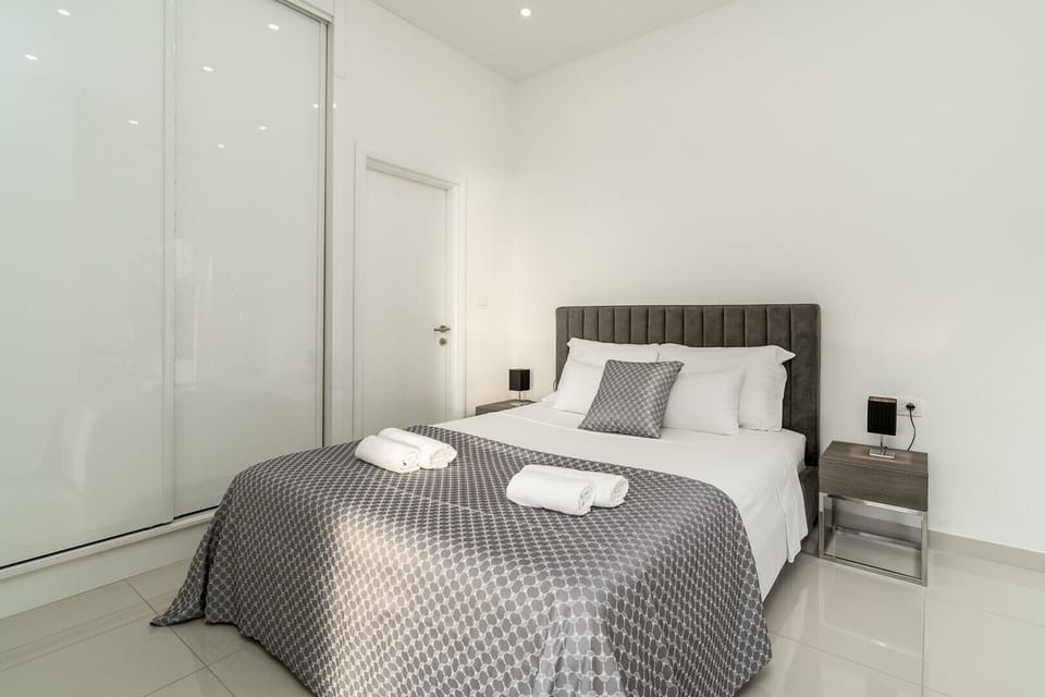 Bedroom No2 offers an en-suite bathroom with a shower, a TV, and A/C
