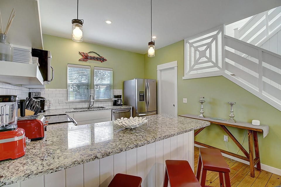 Your spacious kitchen features granite counters and a breakfast bar, perfect for morning coffee or evening wine.