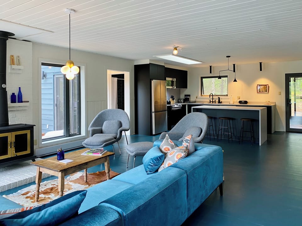 Open concept living/dining/kitchen area is bright and spacious.