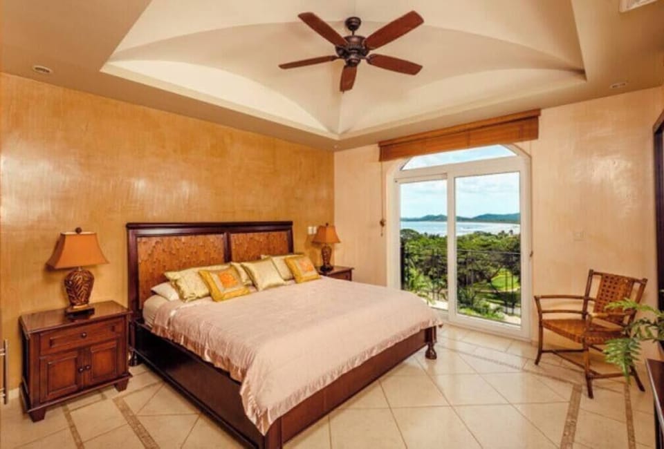 The master bedroom is a furnished with a comfortable king bed. 