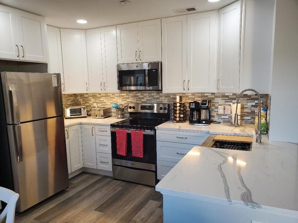 Brand new kitchen with awesome recessed LED lighting on dimmer is yours to enjoy