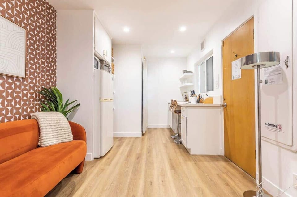 Clean and modern kitchenette with full size fridge and microwave. Pour over coffee maker.
