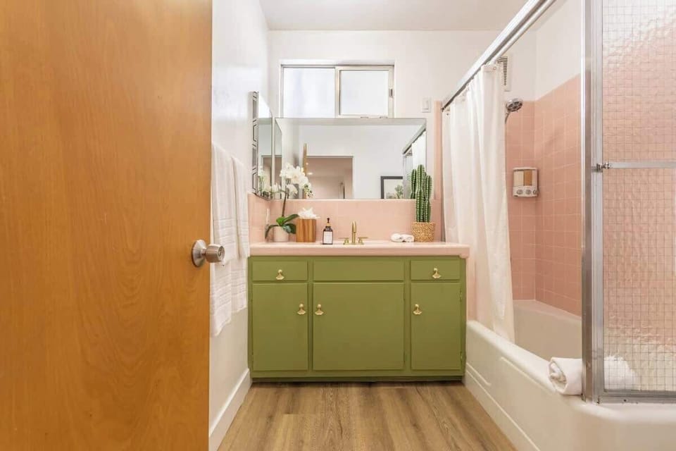 Bright and cheery bathroom with original mid-century tiling. 

