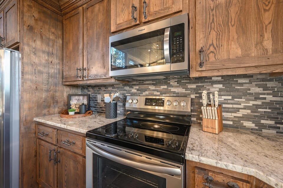 Electric stovetop with an oven and microwave.