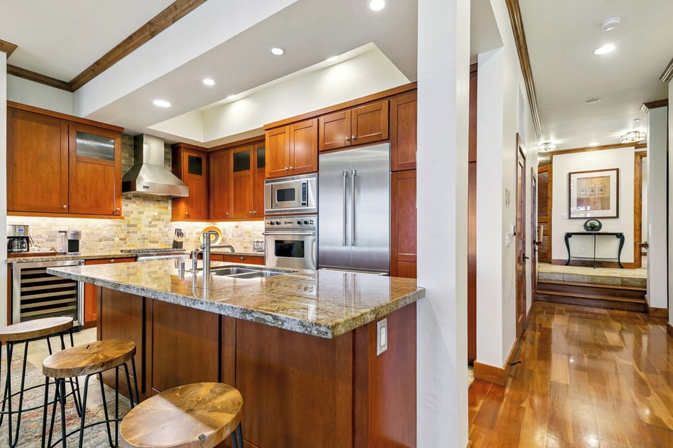 Gather around the kitchen island with seating for three—perfect for casual bites, morning coffee, or keeping the chef company.