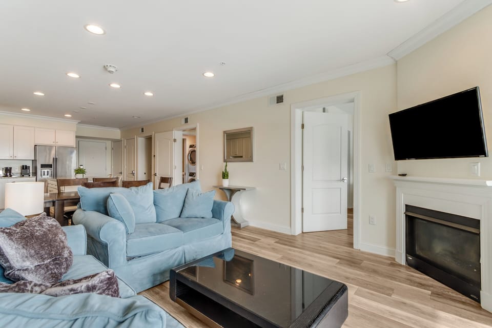 Living area has gas fireplace and flat screen TV 