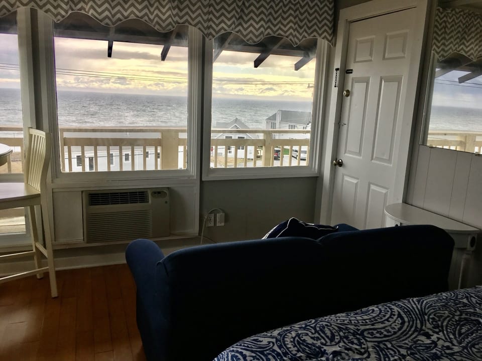 View from bed , sofa and dining table- view of the beach across the street.
