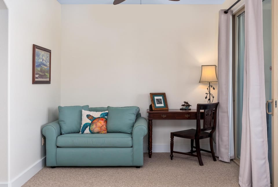 Primary suite with king bed and lounge area