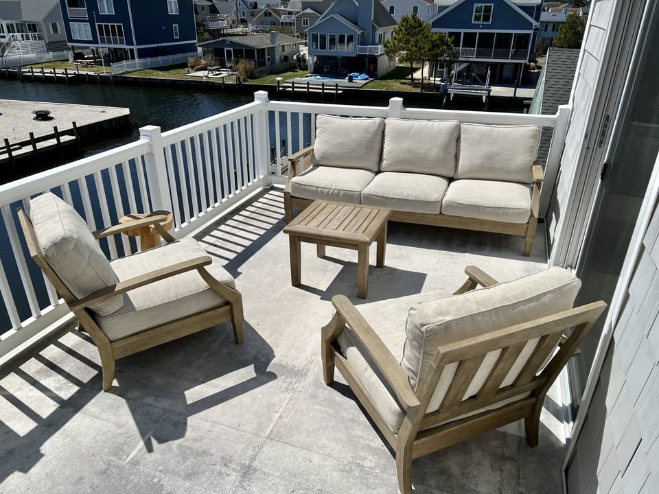 Back porch with seating. Overlooking canal