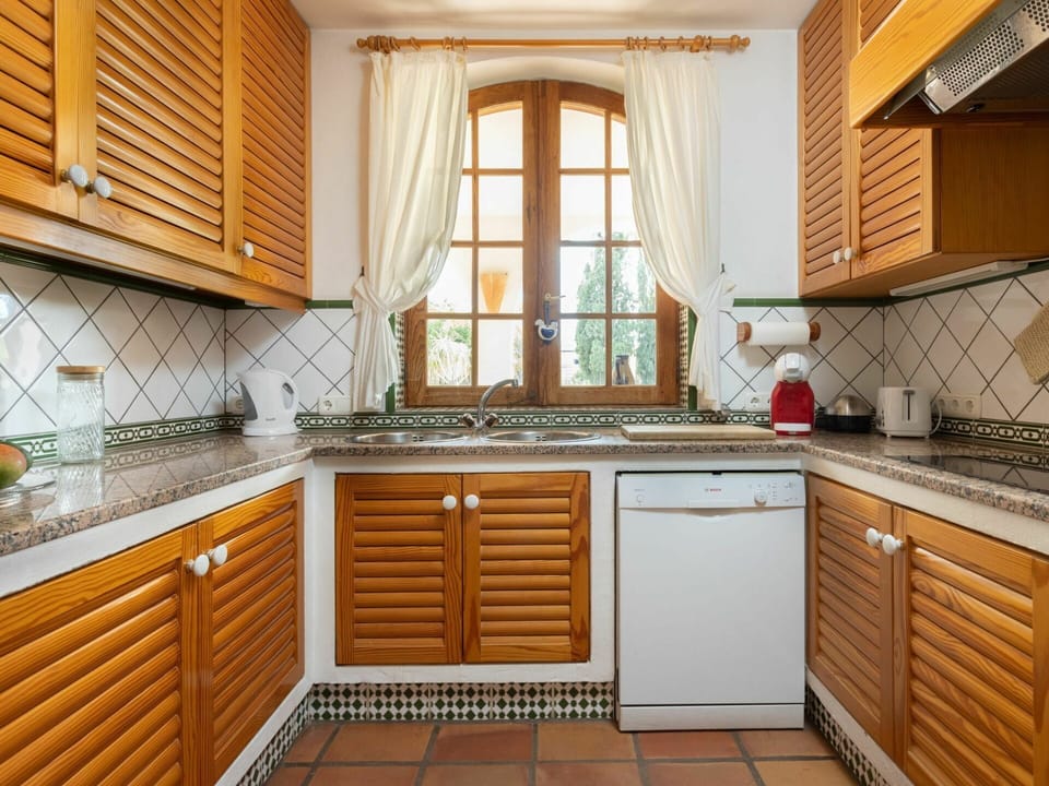 Cabinetry, Countertop, Property, Furniture, Window, Building, Kitchen Stove, Wood, Kitchen Sink, Kitchen