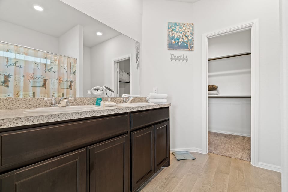 Spacious bathroom space with a walk in closet located at the masters quarters