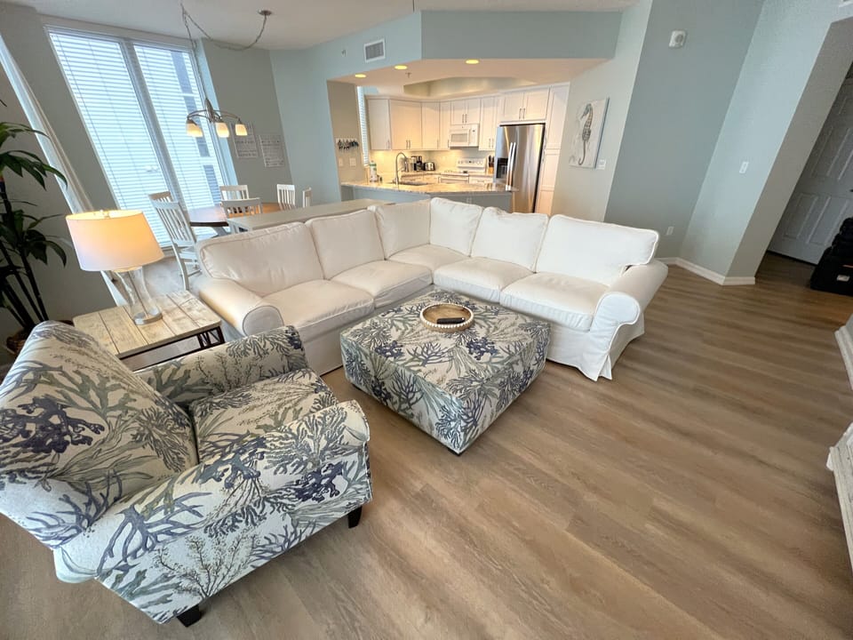 Open and spacious living area in a soothing seaside decor. 