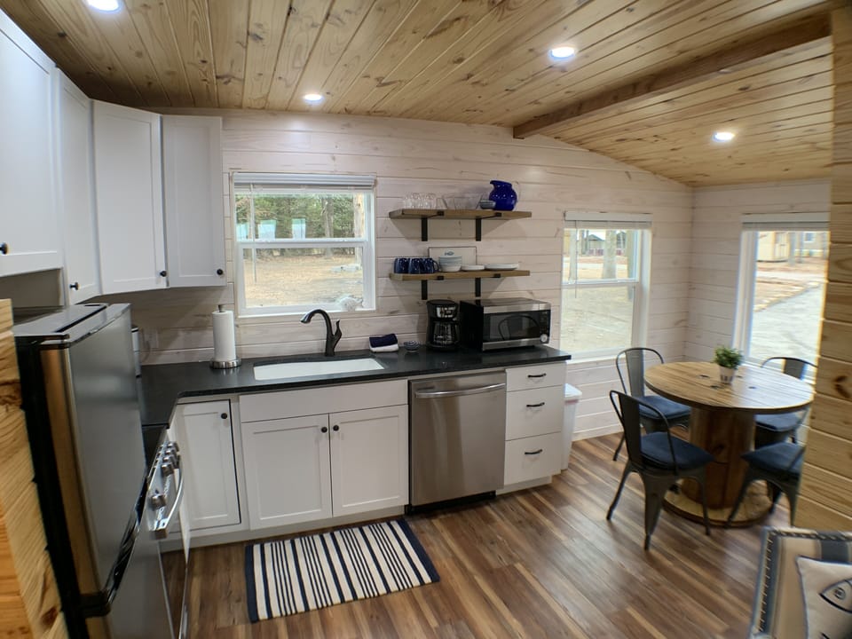 Stainless steel appliances and granite countertops. Dining nook seats 4.