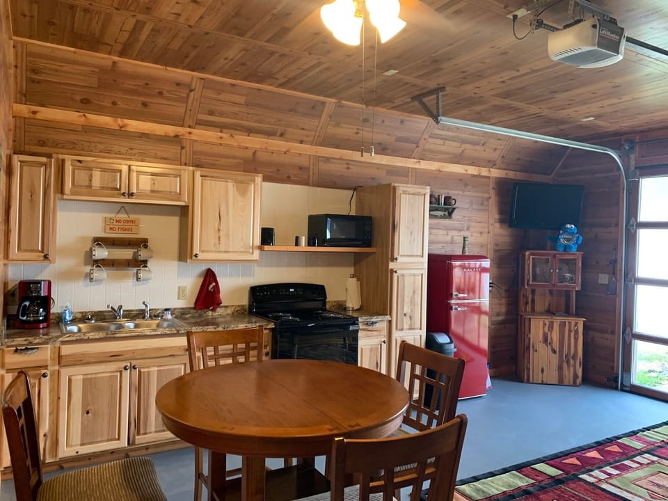 Cabin kitchen/living room - has full size stove