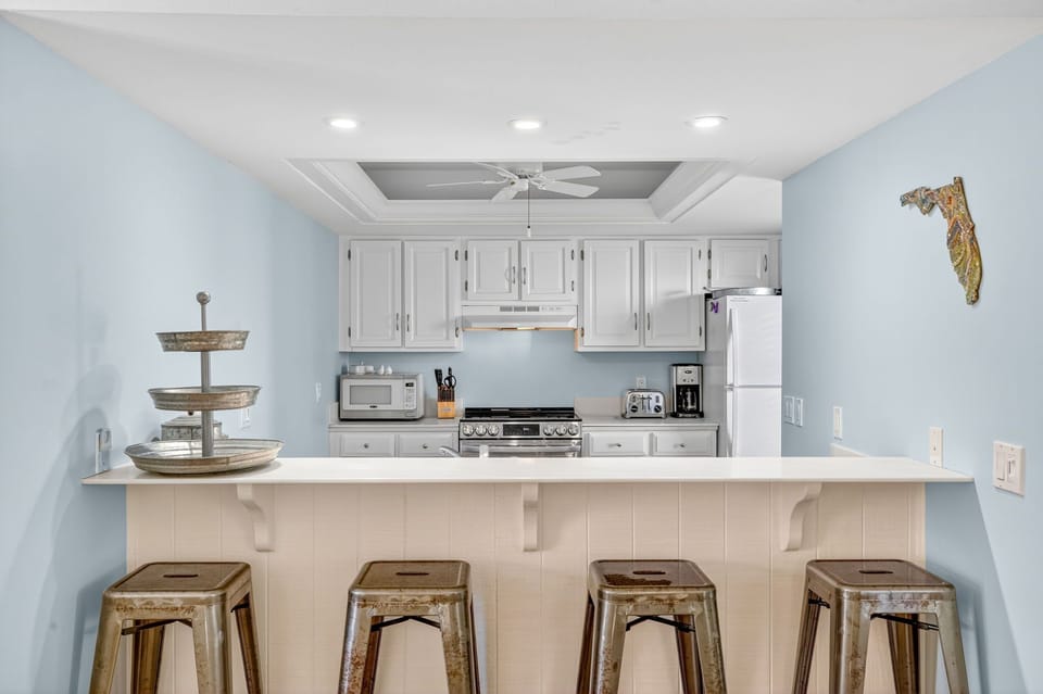 Kitchen with a breakfast bar and barstool seating, offering the perfect spot for casual dining or entertaining.