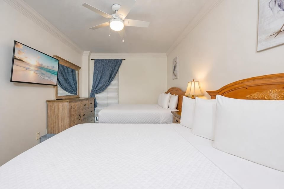 Quiet moments fill the guest suite with two queen beds as you prepare to stream your favorite show on TV