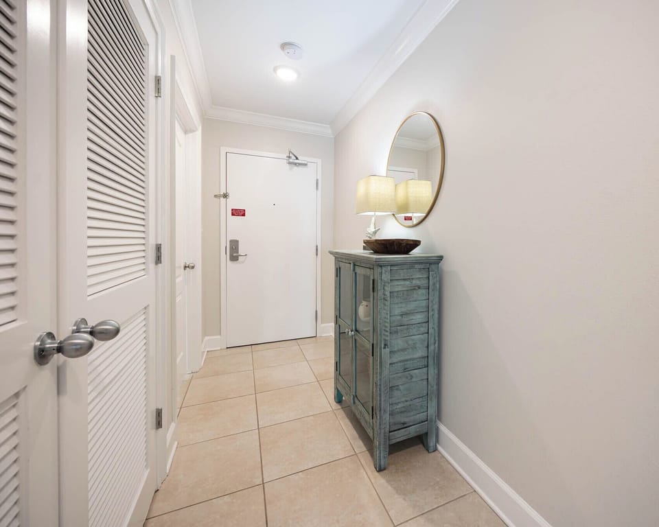 Step into a welcoming entryway featuring stylish decor, a charming console table, and warm lighting for a cozy vibe