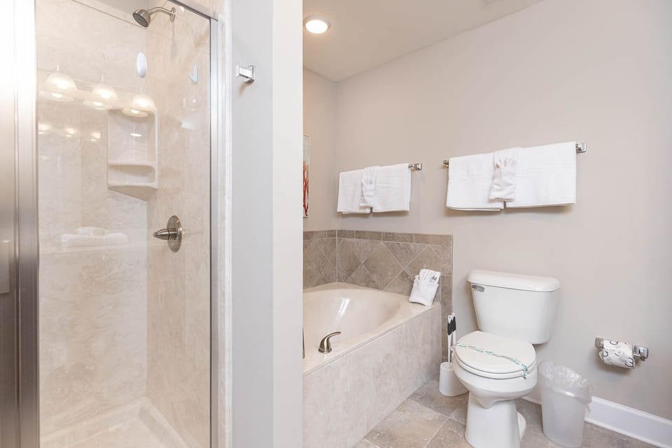 Indulge in relaxation in the master bath with a refreshing walk-in shower and soothing tub