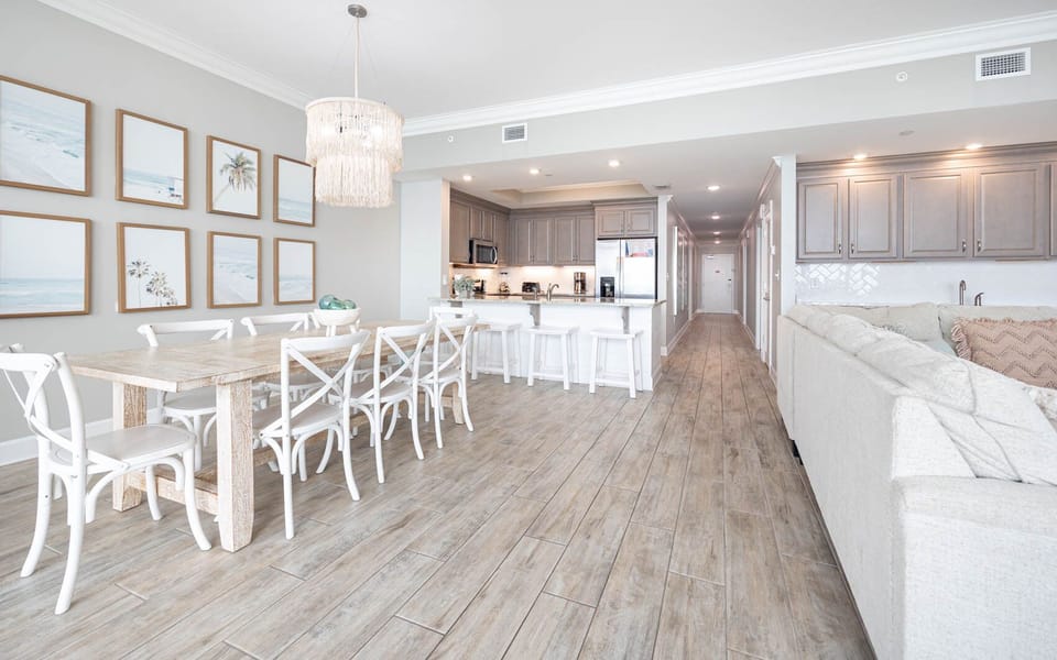 Gather in this welcoming living space and enjoy stunning beach views from the balcony