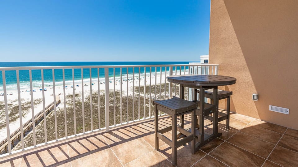 Relax on your balcony and bask in the sunlight with mesmerizing views of the gulf coast on your beach retreat