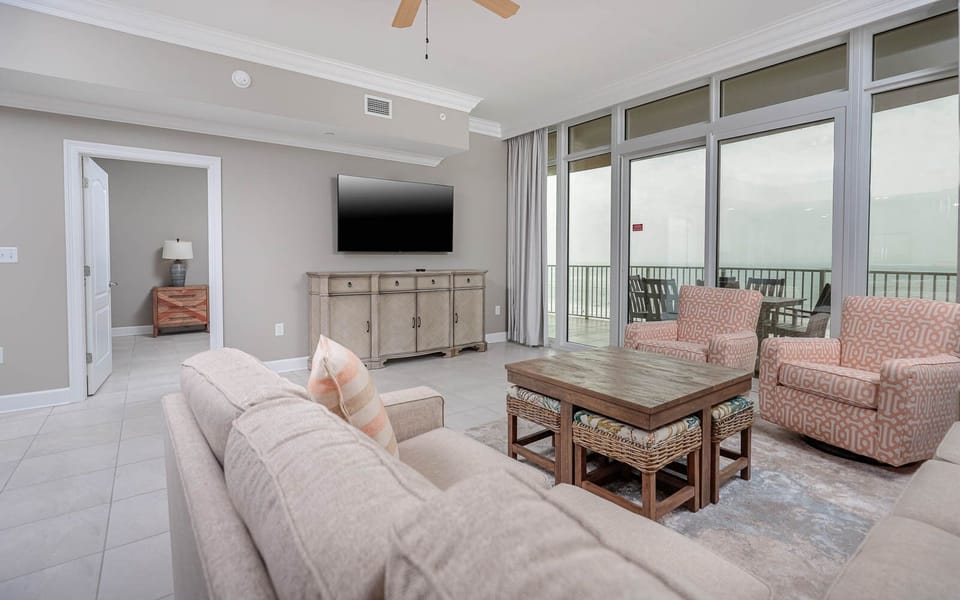 Unwind in the inviting living space with a queen sofa sleeper, where soft seating beckons you to relax and enjoy the view