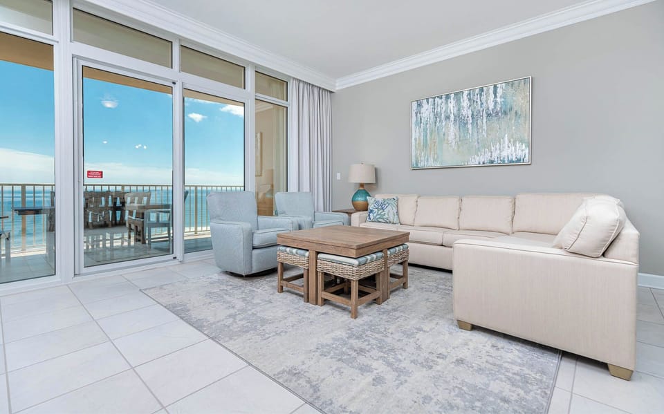 Relax in the inviting living area with a queen sofa sleeper, where comfort meets stunning coast views from the balcony