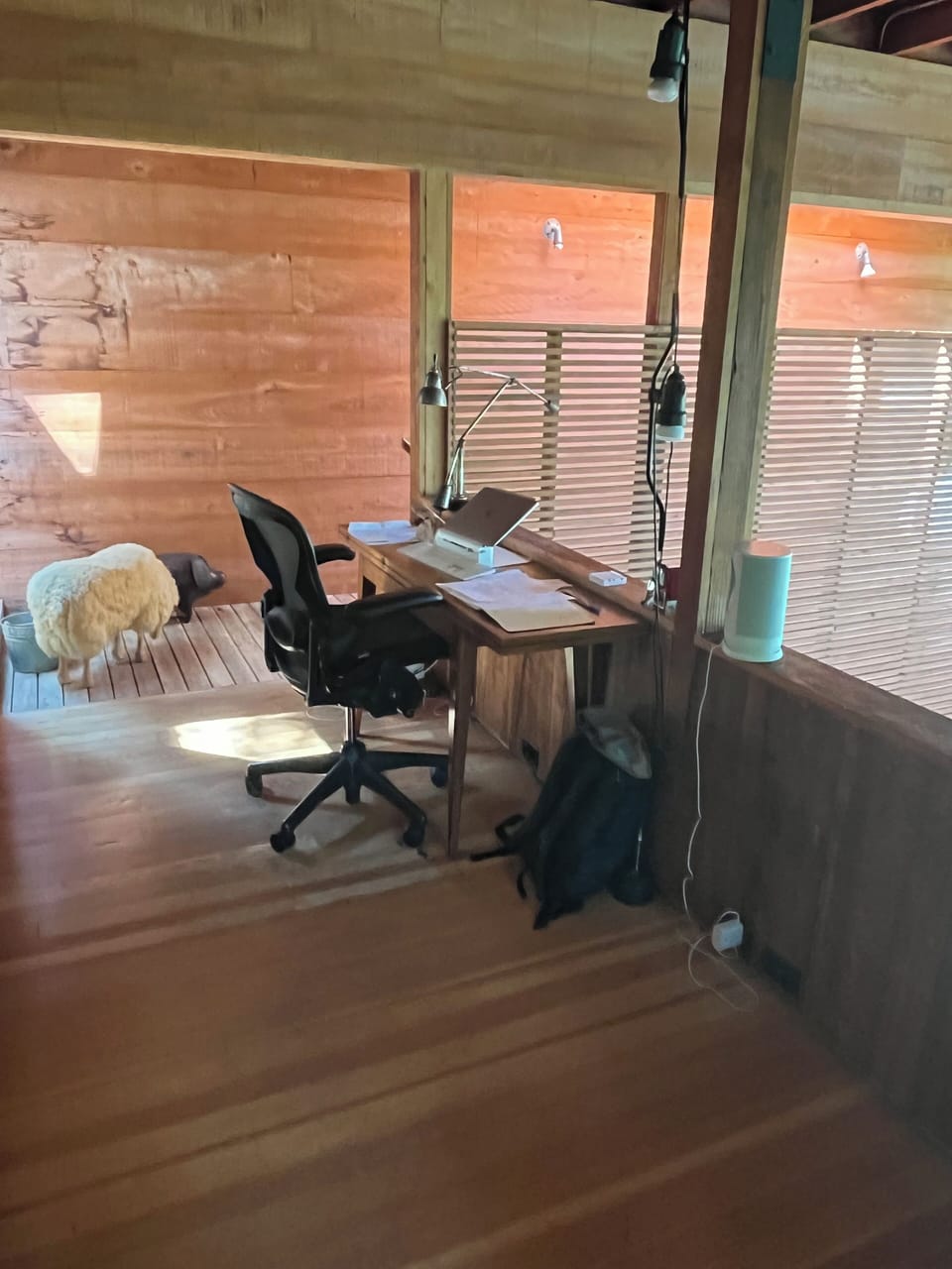 Office upstairs on the balcony overlooking the living area and outside.