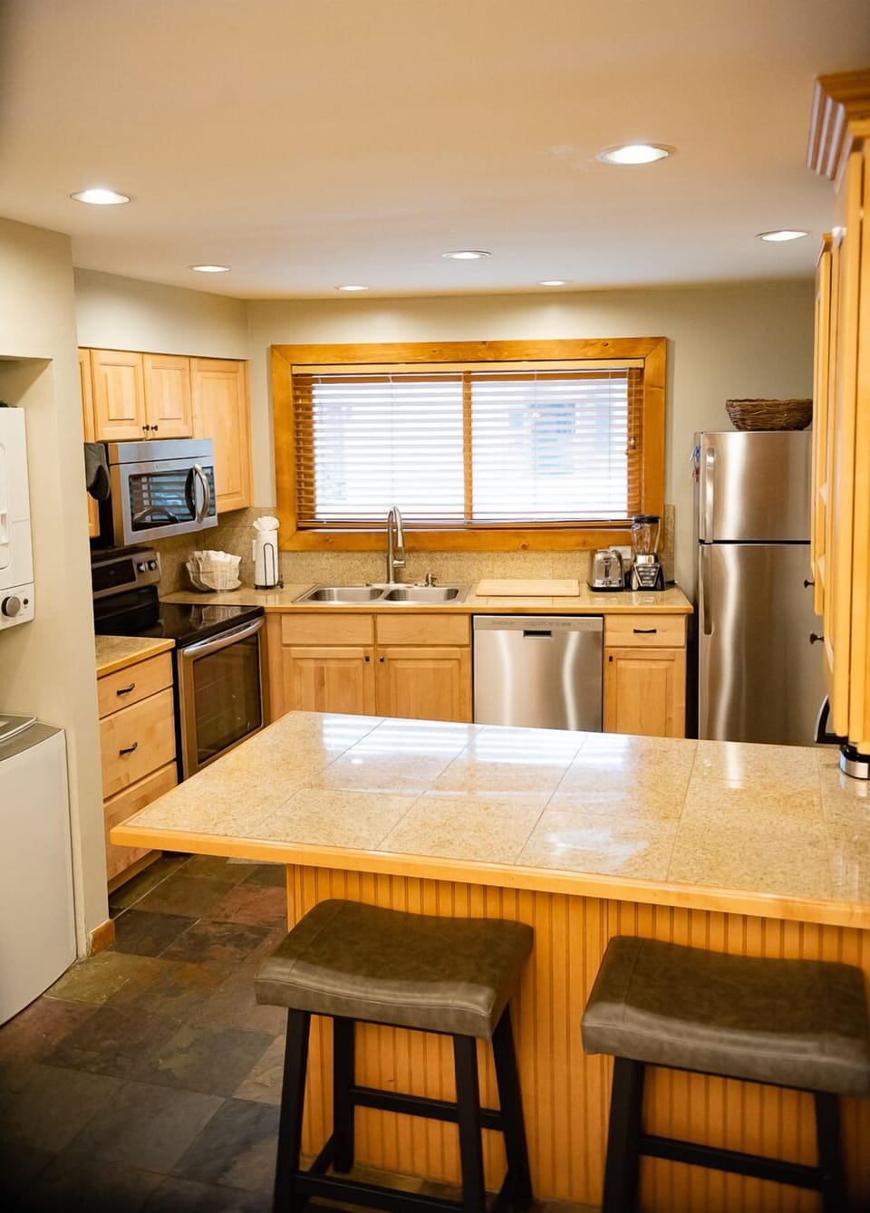 Fully stocked kitchen with counter seating 