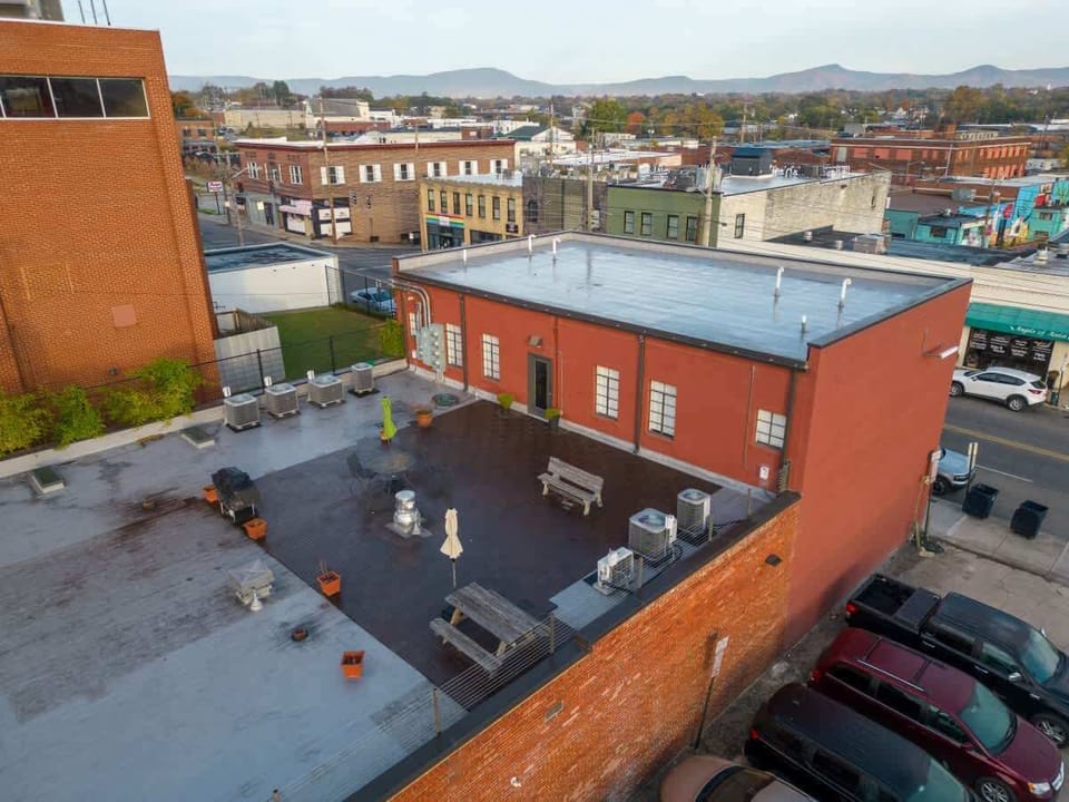 Rooftop view overlooking the city and nearby buildings