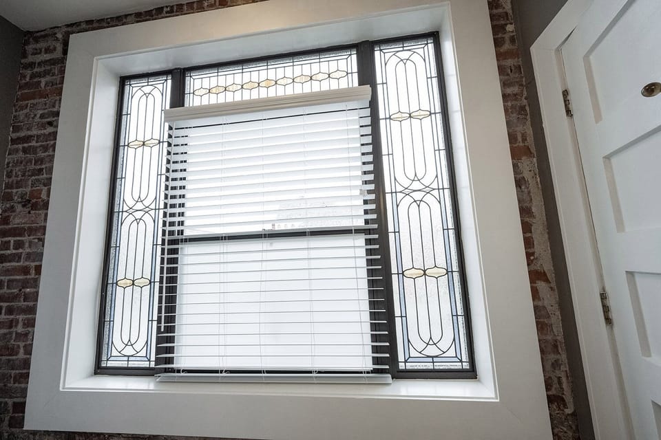 Gorgeous exposed brick and stained glass windows.