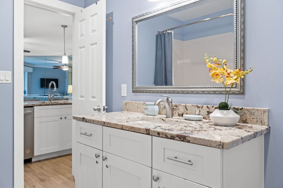 Large bathroom accessible from the kitchen and master bedroom.